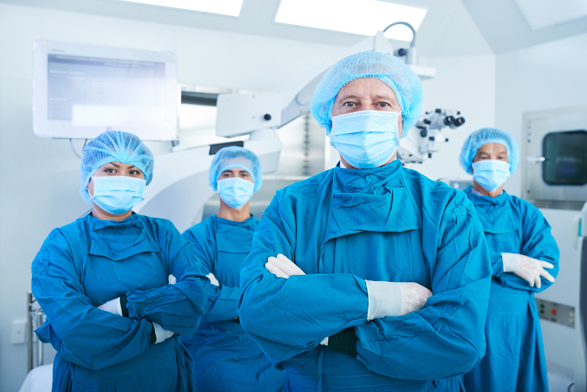 team of surgeons posed looking at the camera