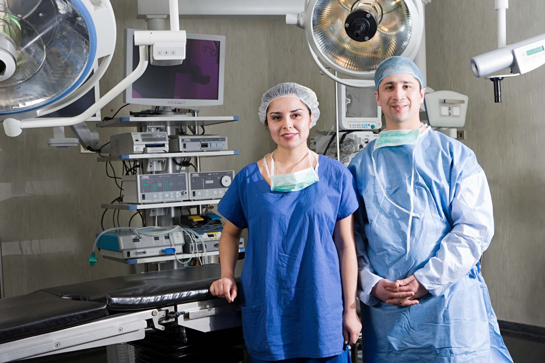 surgeons posing in operating room