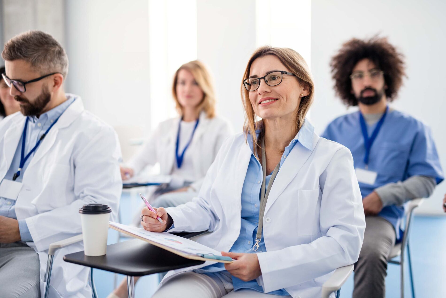 group of doctors smiling at a conference