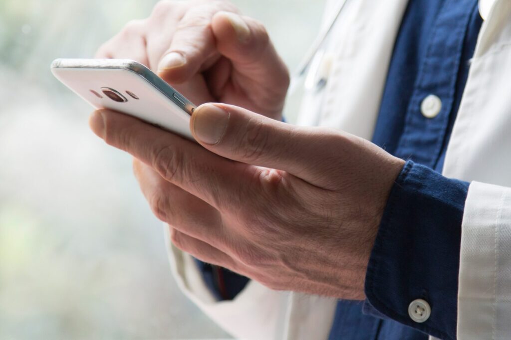 Doctor Using Mobile Phone